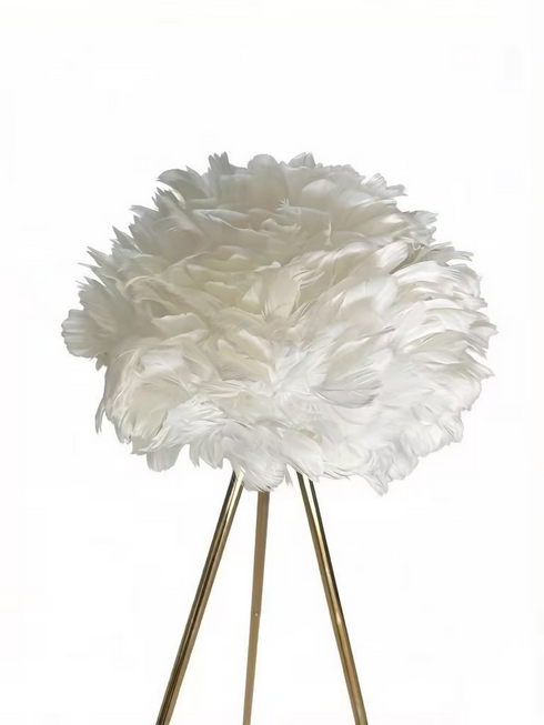 A Decorative Floor Lamp With A Gold Frame And A White Feather Lampshade.