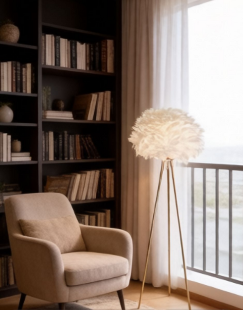 A Decorative Floor Lamp With A Gold Frame And A White Feather Lampshade.